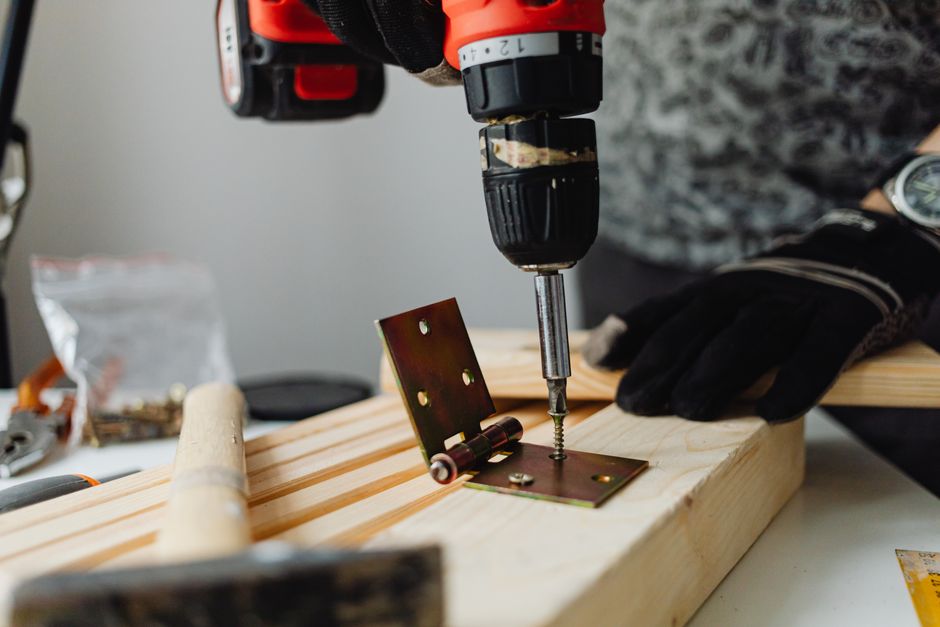 Carpenter professionally installing a new interior door